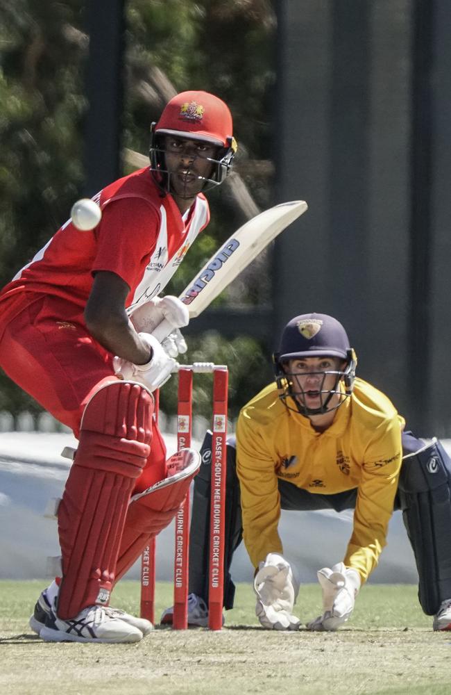 Swans opener Ashley Chandrasinghe negotiates a delivery as Kingston Hawthorn keeper Joel Lewis watches on. Picture: Valeriu Campan