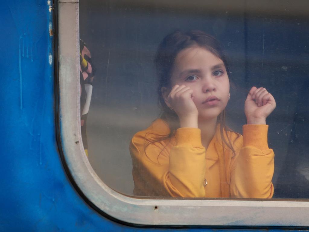 A child waits on the train to Poland at the central train station in Lviv, Ukraine. Picture: Getty Images