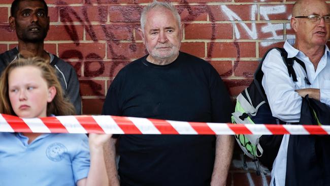 Social worker Les Twentyman watches the fire. Picture: Hamish Blair