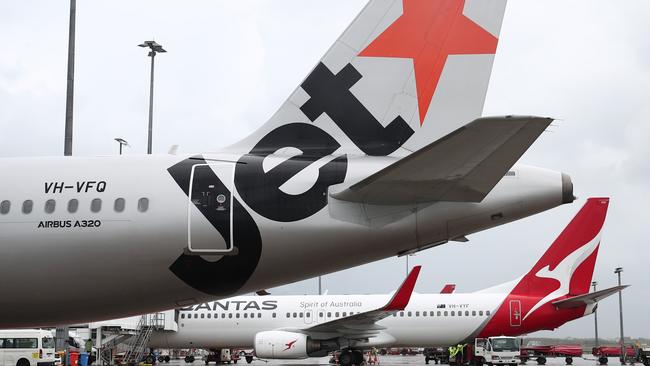 A Jetstar Airbus A320 and Qantas Boeing 737-800 jet aircraft at Cairns Airport. Picture: Brendan Radke.