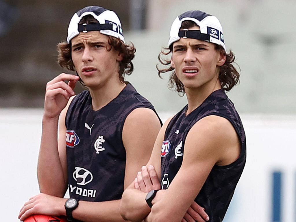 Ben (left) and Lucas Camporeale, twin sons of Scott Camporeale during a Carlton training session. Picture: Michael Klein