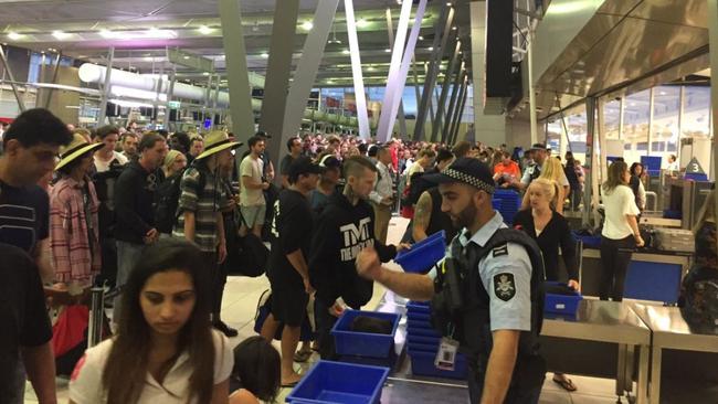 Chaos at check-in at Sydney Airport Terminal T2 (Virgin, Jetstar, Tiger etc...) as the IT system crashes yet again. T1 also affected. No aircraft departures are occurring at present. Pic: Katherine Griffiths via Twitter @KatherineGriffo