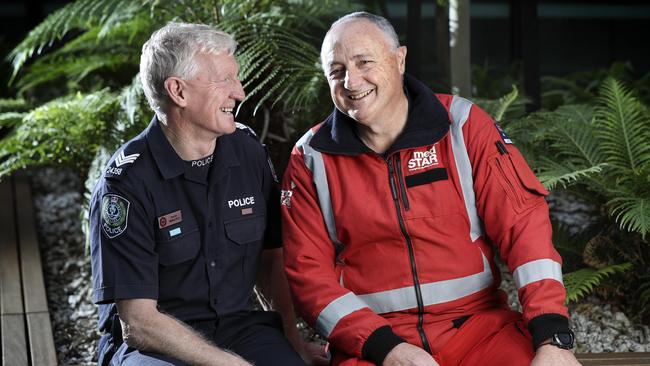 Renowned emergency doctor Bill Griggs with one of the many lives he has saved - ex-STAR Group officer Derrick McManus who was shot while on duty. Picture: Sarah Reed.