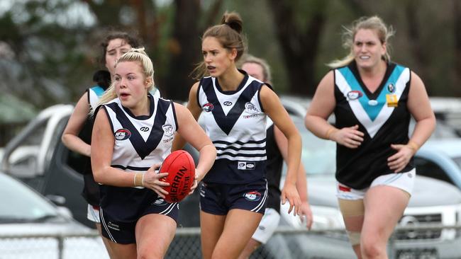 Bundoora’s Jemma Cremore sprints away from a pack on Saturday. Picture: Hamish Blair.