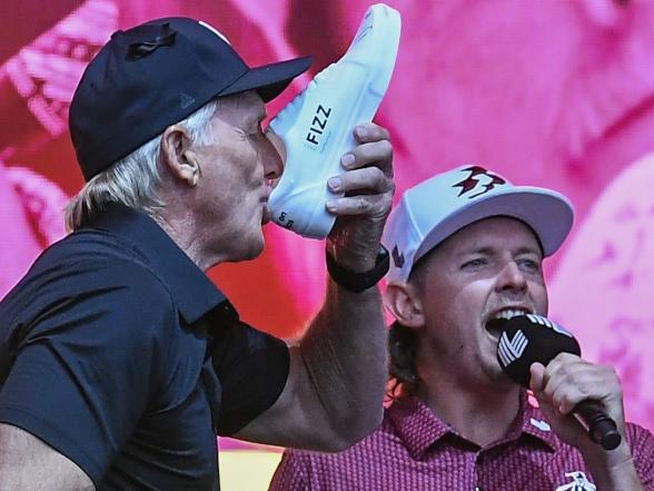 ADELAIDE, AUSTRALIA - APRIL 28:  Greg Norman Commissioner and CEO of LIV Golf  has a shoey on stage with the Ripper team during LIV Adelaide at The Grange Golf Club on April 28, 2024 in Adelaide, Australia. (Photo by Mark Brake/Getty Images)