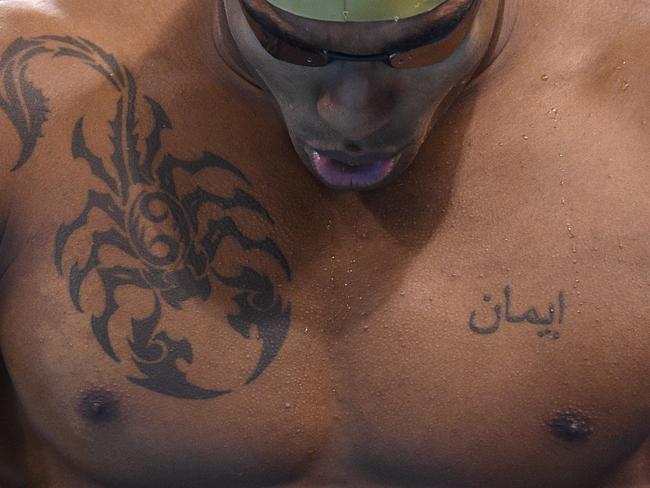 St Lucia's Jordan Augier prepares to compete in a Men's 50m Freestyle heat during the swimming event at the Rio 2016 Olympic Games at the Olympic Aquatics Stadium in Rio de Janeiro on August 11, 2016. / AFP PHOTO / Martin BUREAU