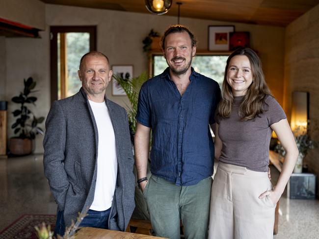 Grand Designs Australia host Anthony Burke with homeowners Dan Rawlins and Chloe Meyer on their property at Franklin, Tasmania. Picture: Brad Harris