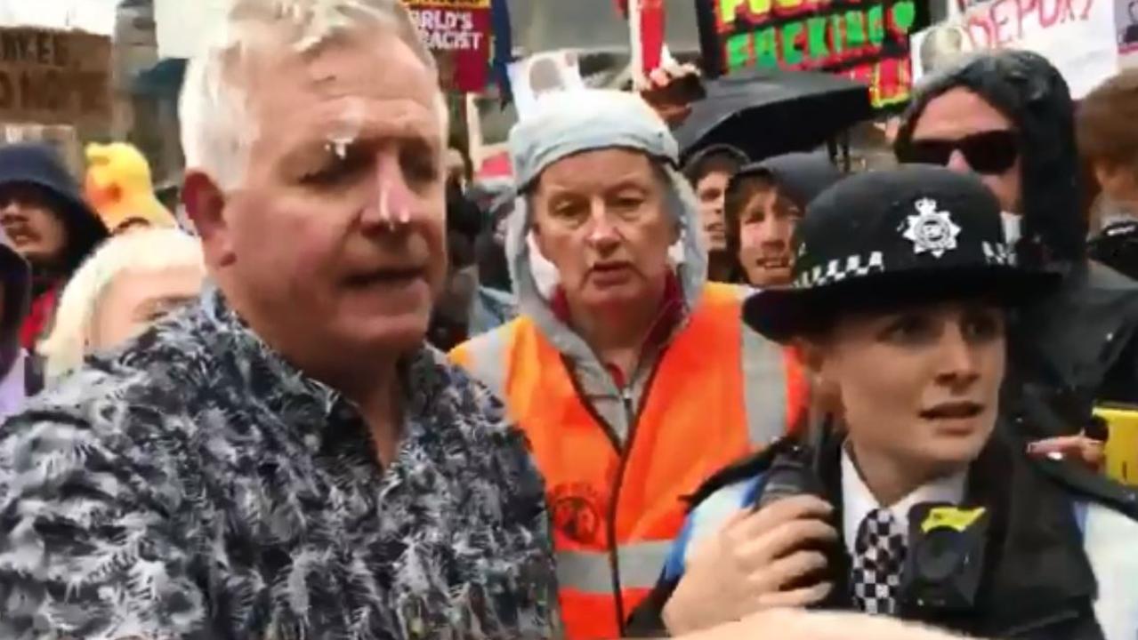 A Trump supporter is ‘milkshaked’ at the protests against the US President’s state visit in London.