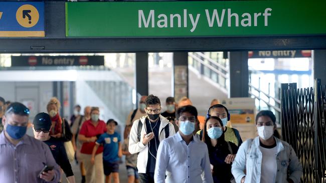 Commuters wearing masks at Manly Wharf. Picture: Jeremy Piper