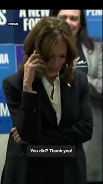 Video appears to show Kamala making a fake phone call in front of crowd