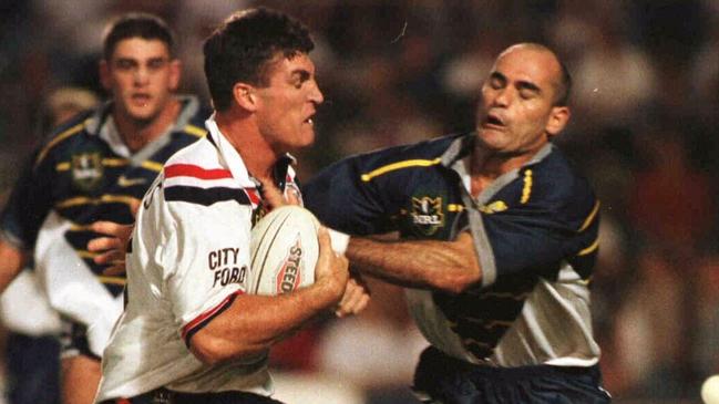 Dale Shearer attempts to stop Rooster Nigel Gaffey in 1998.