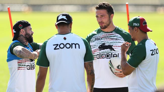 Sam Burgess talks with Adam Reynolds, John Sutton and Cody Walker during South Sydney training at Redfern Oval on Monday. Picture: Brett Costello