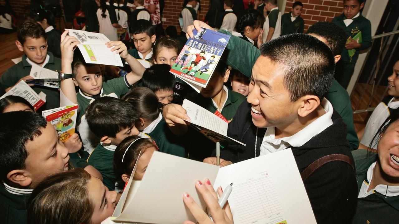 Author Anh Do is mobbed by students who love his many books.