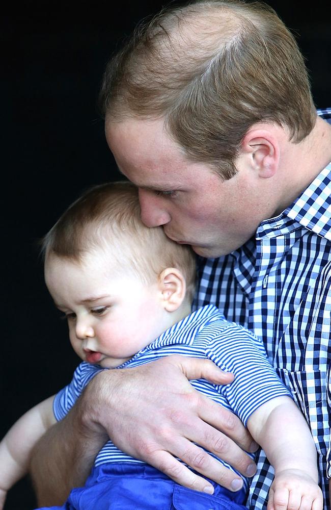 Prince William gives this little prince a bottle at night. 