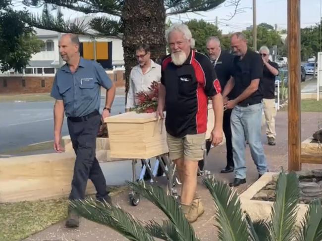 Pall-bearers take the coffin of Brian Jensen from the Calvary Catholic Church in Miami following his funeral service.