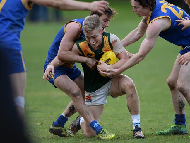 Lachlan Walker lays a tackle for De La Salle this year. Picture: Chris Eastman/AAP