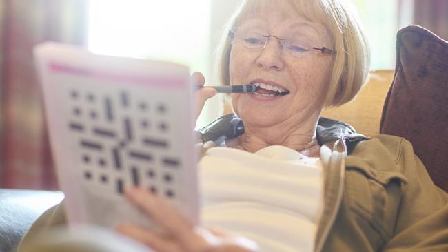 Monash University study suggests challenging the brain regularly by doing crosswords may help avoid dementia.