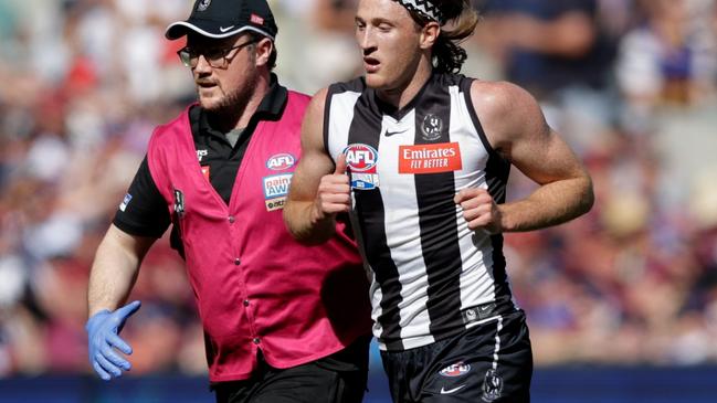 MELBOURNE, AUSTRALIA - SEPTEMBER 30: Nathan Murphy of the Magpies leaves the ground in the hands of a trainer during the 2023 AFL Grand Final match between the Collingwood Magpies and the Brisbane Lions at the Melbourne Cricket Ground on September 30, 2023 in Melbourne, Australia. (Photo by Russell Freeman/AFL Photos via Getty Images)