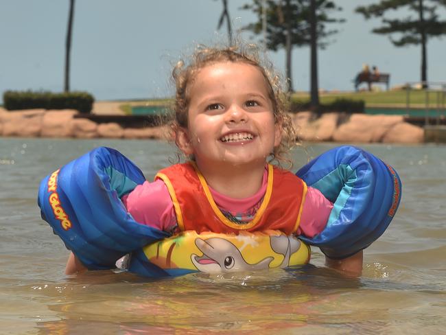 Lily Mansey, 2, from the Sunshine Coast practices her turtle swimming at the rock pool on the Strand. Picture: Evan Morgan