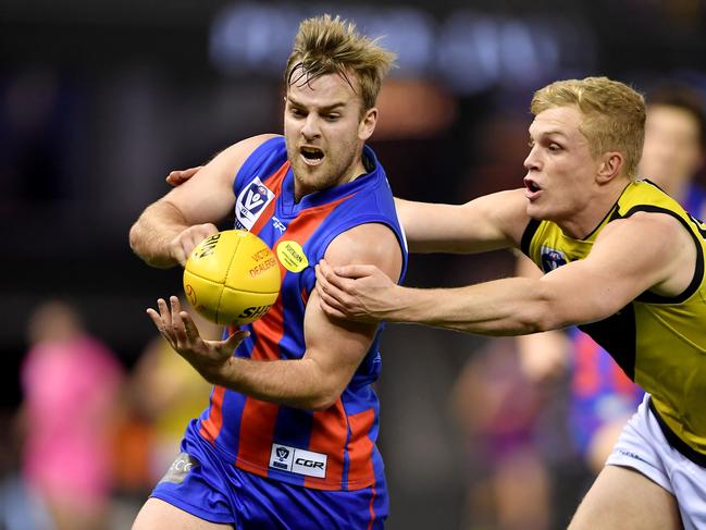 Blake Pearson dishes off a handball. Picture: Andy Brownbill