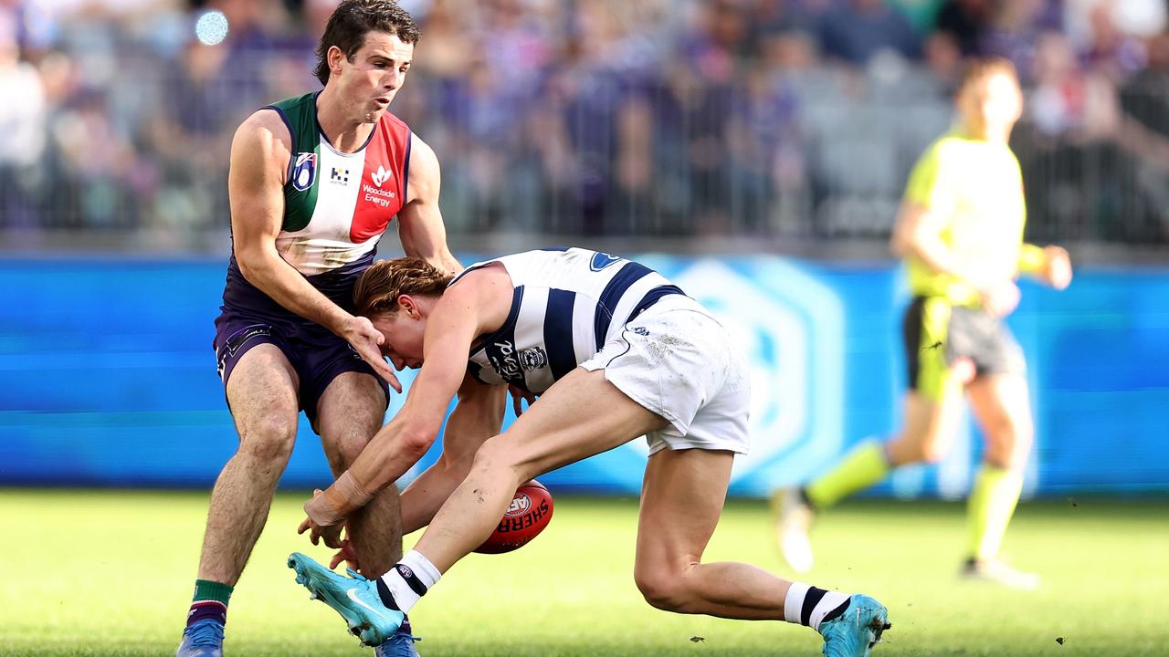 PERTH, AUSTRALIA - AUGUST 10: Tanner Bruhn of the Cats runs into Andrew Brayshaw of the Dockers during the round 22 AFL match between Fremantle Dockers and Geelong Cats at Optus Stadium, on August 10, 2024, in Perth, Australia. (Photo by Paul Kane/Getty Images)