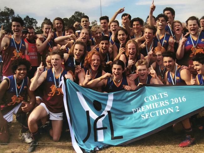 Isaac Quaynor (left, front row) celebrates Beverley Hills' YJFL premiership in 2016. Picture: Supplied