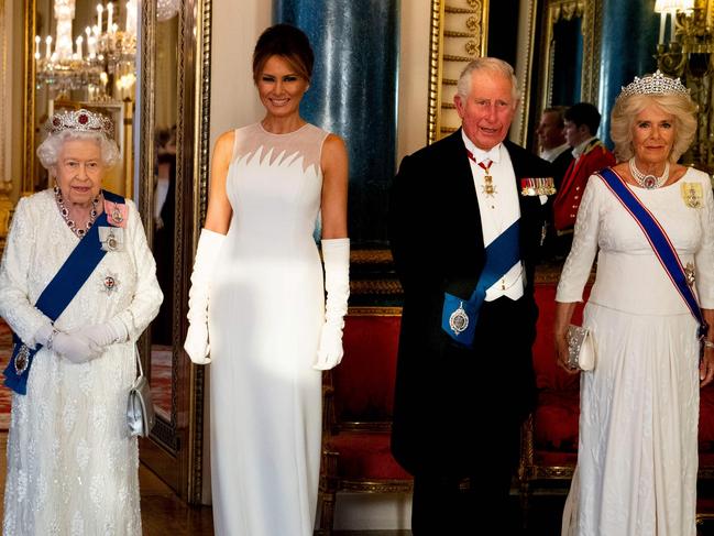 TOPSHOT - Britain's Queen Elizabeth II (2L), US President Donald Trump (L), US First Lady Melania Trump (C), Britain's Prince Charles, Prince of Wales (2R) and Britain's Camilla, Duchess of Cornwall pose for a photograph ahead of a State Banquet in the ballroom at Buckingham Palace in central London on June 3, 2019, on the first day of the US president and First Lady's three-day State Visit to the UK. - Britain rolled out the red carpet for US President Donald Trump on June 3 as he arrived in Britain for a state visit already overshadowed by his outspoken remarks on Brexit. (Photo by Doug Mills / POOL / AFP)