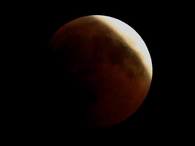 The moon during the total lunar eclipse, in the Israeli Mediterranean coastal city of Netanya. Picture:  AFP