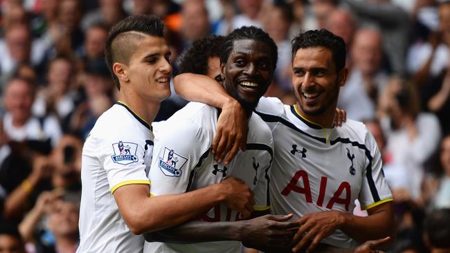 LONDON, ENGLAND - AUGUST 24: Emmanuel Adebayor of Spurs celebrates his goal with team mates during the Barclays Premier League match between Tottenham Hotspur and Queens Park Rangers at White Hart Lane on August 24, 2014 in London, England. (Photo by Jamie McDonald/Getty Images)