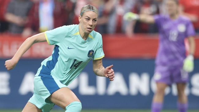 VANCOUVER, BRITISH COLUMBIA - DECEMBER 05: Alanna Kennedy #14 of Australia controls the ball during the first half against Canada at BC Place on December 05, 2023 in Vancouver, British Columbia. (Photo by Craig Mitchelldyer/Getty Images for Football Australia)