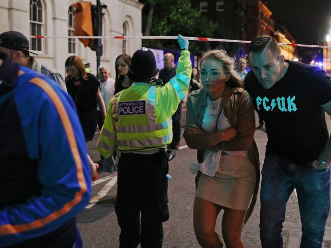 Members of the public are led away from the scene near London Bridge after a terrorist attack. Picture: Getty Images