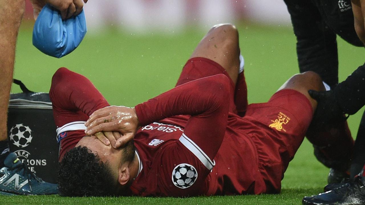 Liverpool's Alex Oxlade-Chamberlain reacts after picking up an injury during the UEFA Champions League semi-final.
