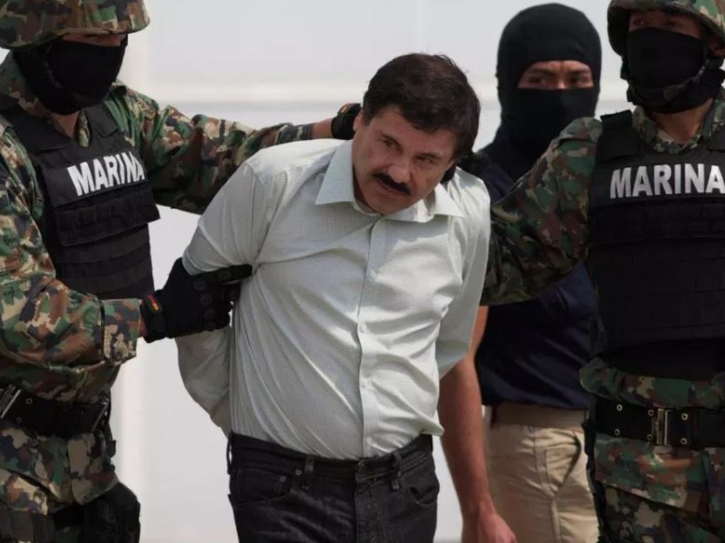 El Chapo, pictured during his arrest, once rivalled Pablo Escobar for his power and control of the international drugs trade.