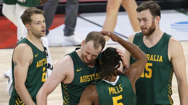 LAS VEGAS, NEVADA - JULY 10:  Patty Mills #5 of the Australia Boomers is congratulated by teammates Nathan Sobey #2, Joe Ingles #7 and Nick Kay #15 after Mills hit a 3-pointer against Argentina at the end of regulation of their exhibition game for an 87-84 win at Michelob ULTRA Arena ahead of the Tokyo Olympic Games on July 10, 2021 in Las Vegas, Nevada.  (Photo by Ethan Miller/Getty Images)