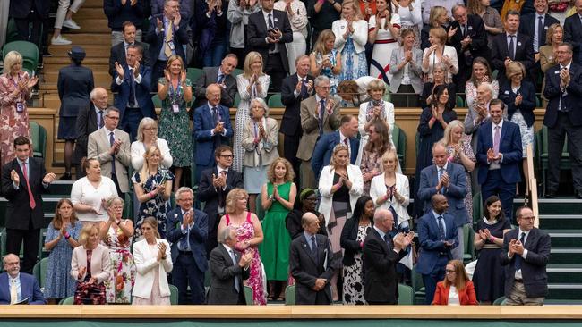 The Royal Box stands and applauds Oxford University and AstraZeneca scientist, one of the people behind the successful COVID-19 vaccine, Professor Sarah Gilbert (front row, third from right) at Wimbledon on June 28. Picture: AFP