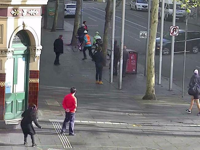 The car spins around on Swanston St on Grand Final day.