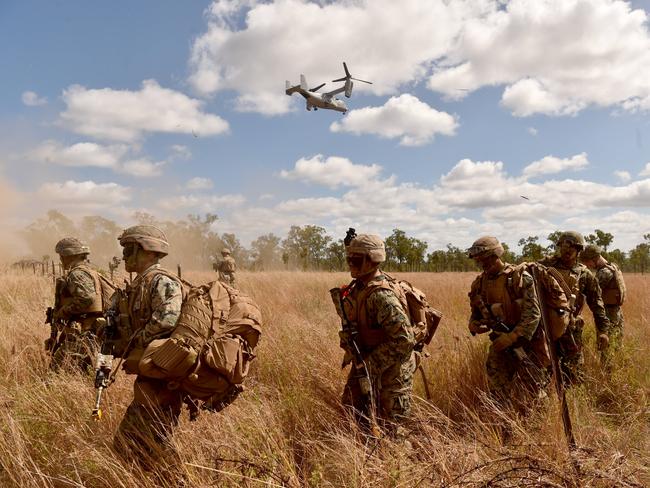 US Marines in conjunction with Australian soldiers from Battle Group Eagle comprising of elements of 3rd Brigade conduct an urban clearance of a fictitious invading force at the Townsville Filed Training Area. A US Marine V-22 Osprey lands marines. Picture: Evan Morgan