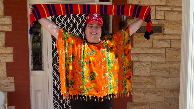 Adelaide United's head of commercial Adam Thompson and communications chief Marius Zanin have delivered packs to some of the club's longest serving season ticket holders including Sonia Di Pardo. Picture: Adelaide United