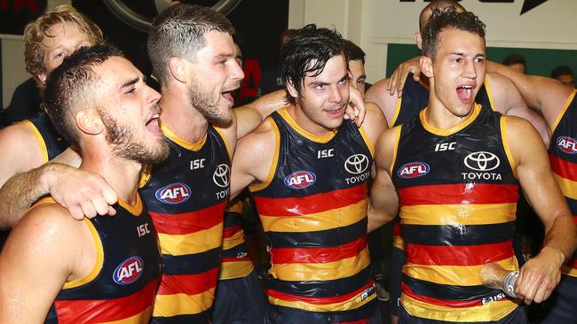 FOUR TO THE FORE: Lachlan Murphy (left), Bryce Gibbs, Darcy Fogarty and Tom Doedee celebrate their first win for Adelaide. Picture: Sarah Reed.