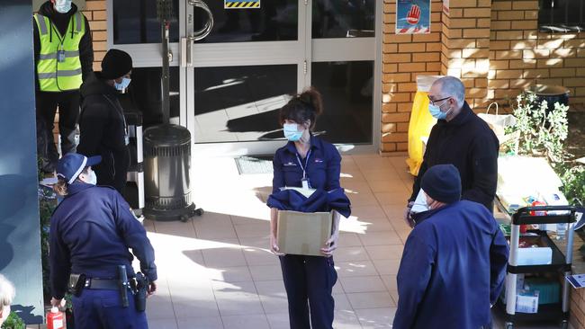 Police and security officers outside the Bondi block today. Picture John Grainger