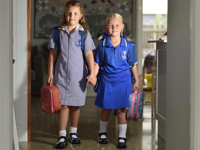 Mia and Lucy McLennan will be starting Prep and Year 1 in Townsville tomorrow. PICTURE: MATT TAYLOR.