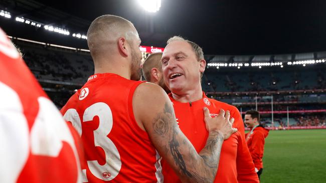 John Longmire celebrates a win with Lance Franklin last year.