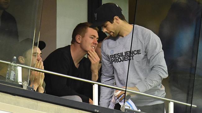 Cotchin took in the VFL grand final with a cloud hanging over his head. Picture: AAP