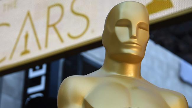 (FILES) In this file photo an Oscar statue is seen at the red carpet arrivals area as preparations continue for the 88th Annual Academy Awards at Hollywood & Highland Center on February 25, 2016 in Hollywood, California. - Streaming films like "Mank" and "The Trial of the Chicago 7" will battle with frontrunner "Nomadland" for the March 15, 2021 coveted Oscar nominations, setting up the grand finale to an awards season transformed by the pandemic. With most US movie theaters closed all year due to Covid, the Academy Awards have been delayed to their latest-ever date -- April 25 -- while several big-screen studio blockbusters skipped their 2020 releases entirely, leaving an eclectic field of hopefuls. (Photo by ROBYN BECK / AFP)