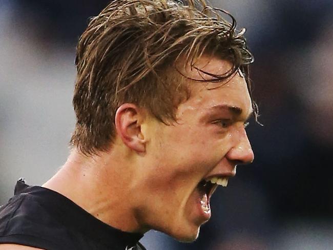 MELBOURNE, AUSTRALIA - AUGUST 23: Patrick Cripps of the Blues celebrates a goal during the round 21 AFL match between the Carlton Blues and the Melbourne Demons at Melbourne Cricket Ground on August 23, 2015 in Melbourne, Australia. (Photo by Michael Dodge/Getty Images)