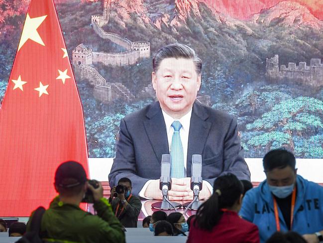 A screen shows Chinese President Xi Jinping delivering a speech via video for the opening ceremony of the 3rd China International Import Expo (CIIE) at a media centre in Shanghai on November 4, 2020. (Photo by STR / AFP) / China OUT