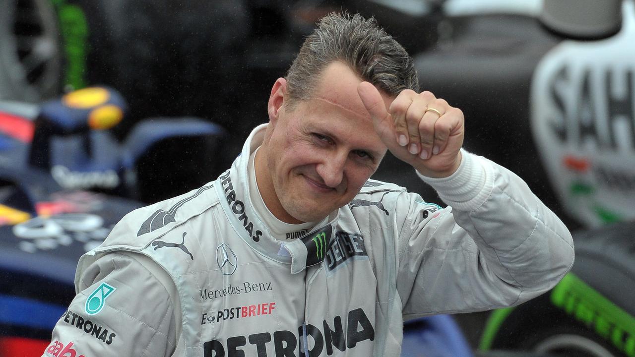 Michael Schumacher salutes the crowd in 2012. Photo by Yasuyoshi CHIBA / AFP