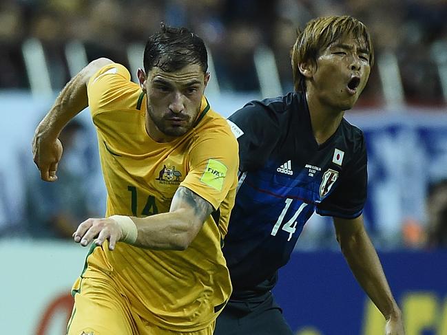 James Troisi of Australia takes on the defence of Takashi Inui of Japan during 2018 FIFA World Cup Asian Qualifier match between Japan and Australia at the Saitama Stadium in Saitama, Thursday, August 31, 2017. (AAP Image/Matt Roberts) NO ARCHIVING, EDITORIAL USE ONLY