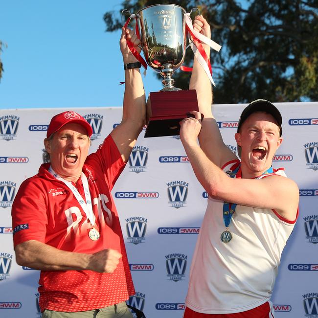 Ararat coach Matthew Walder and captain Riley Taylor lift the Wimmera league premiership cup. Picture: Yuri Kouzmin