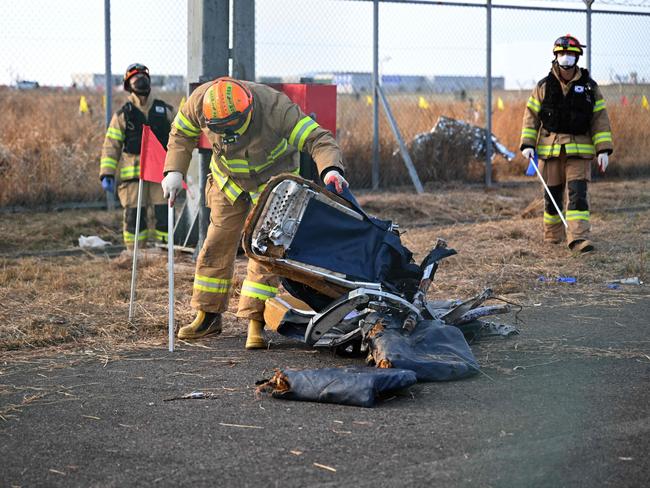 Recovery teams work at the scene where a Jeju Air Boeing 737-800 series aircraft crashed. None survived except two flight attendants pulled from the wreckage. Picture: AFP